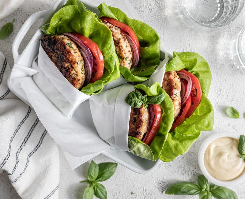 Chicken Burger with sun-dried tomato, feta, and basil